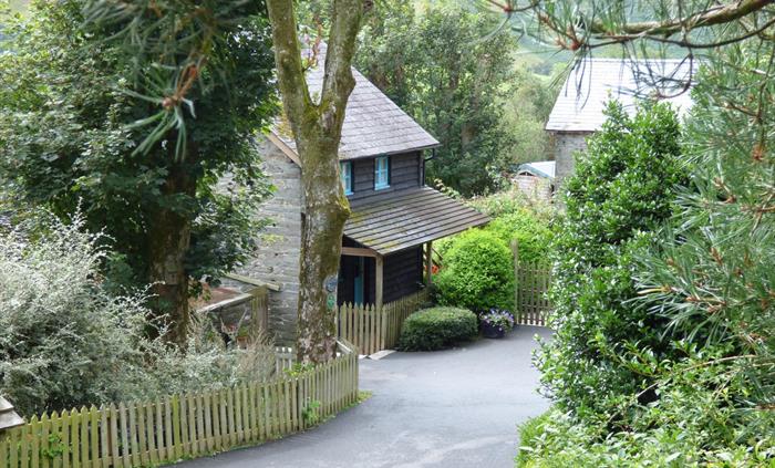 The Granary self catering cottage is surrounded by gardens and trees.